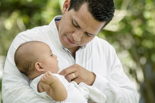Dad holding his baby