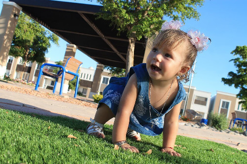Baby girl crawling.