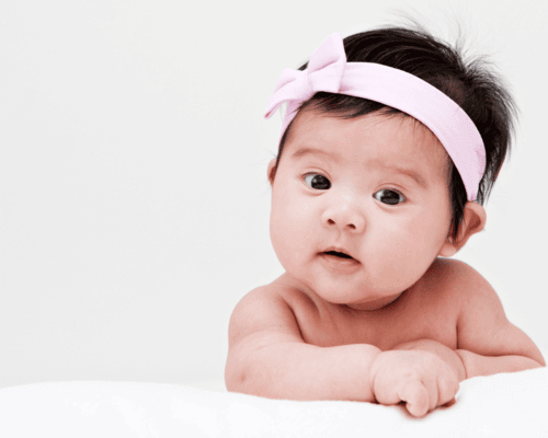 Baby girl with pink headband Baby girl with pink headband