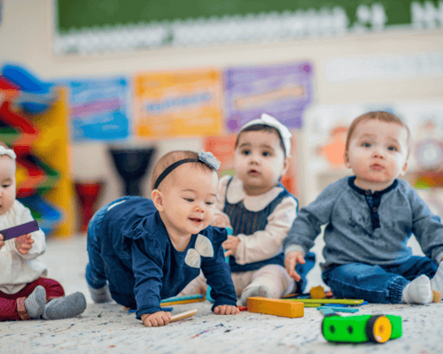 Baby boy and girl in daycare. Baby boy and girl in daycare.