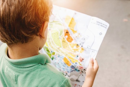 boy looking at map.