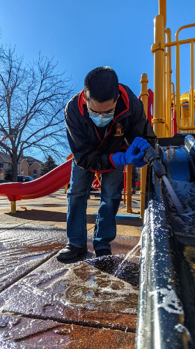 Man cleaning playground.