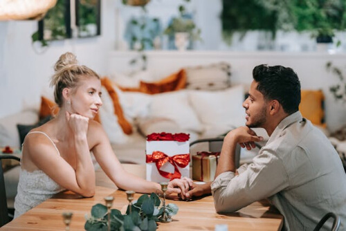 Couple looking lovingly into each others eyes.