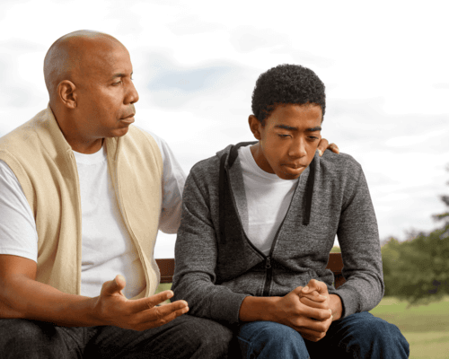 Dad talkingseriously to son
