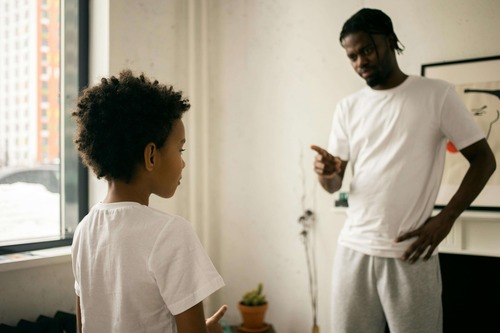 Dad upset with boy.