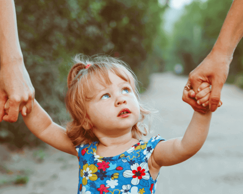 Little girl holding hand with adults. Little girl holding hand with adults.