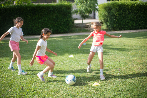 Girls playing soccer.