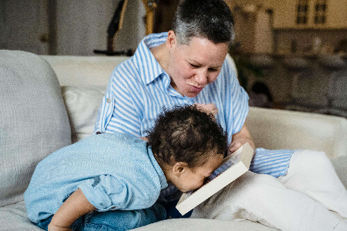 Reading to boy.