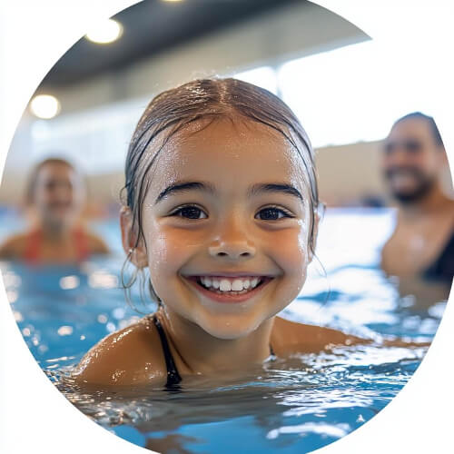 Little girl swimming in pool.
