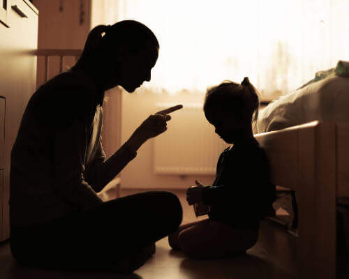 Mom disciplining young child.