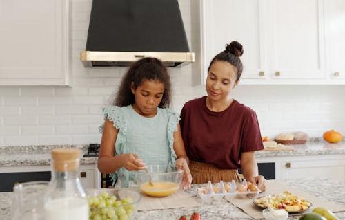 Mom is showing daughter how to cook.