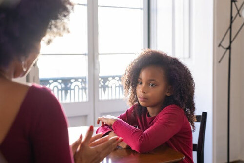 Mom using positive discipline on daughter.