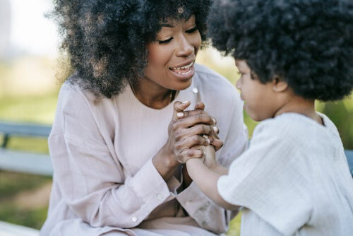 Mom using positive discipline on son.