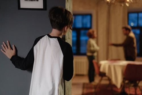 Parents arguing, son watching.