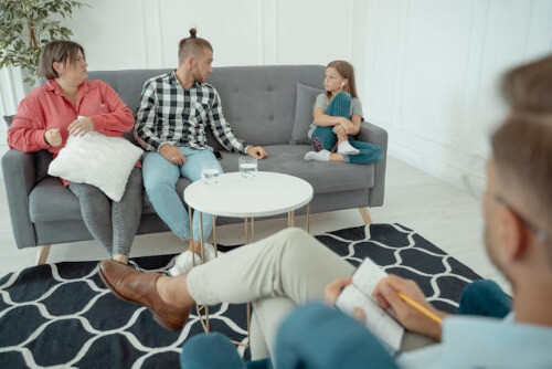 Parents in therapy with child.