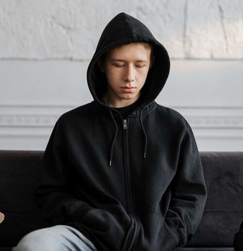 Sad and depressed teen boy.