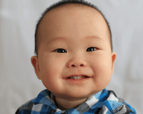 Baby boy with huge smiles.