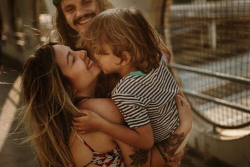 Boy happy with parents Boy happy with parents