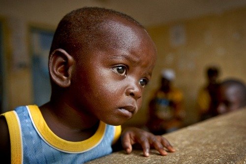 Boy sitting in deep thought.