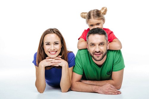 Family of 3 lying on floor