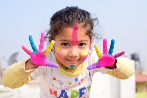 Girl with fingerpaint on her hands