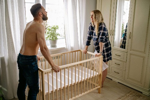 Mom and dad setting up nursery.