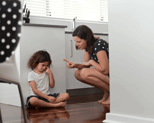 Mom discipling child in time-out.