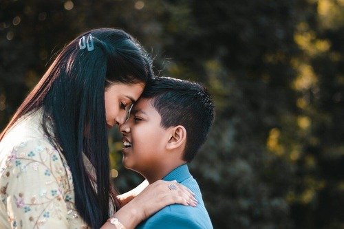 Mom and son forhead to forhead