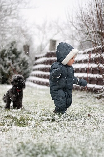 One year old toddler outside.