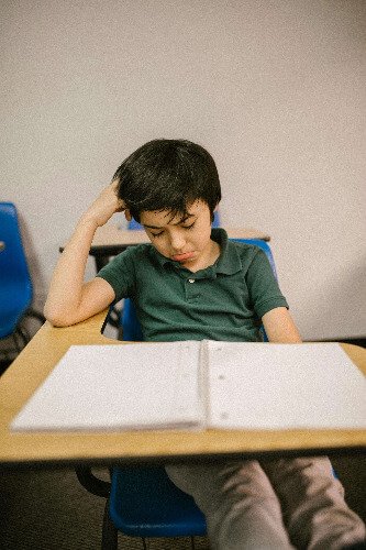 Sad boy at school.
