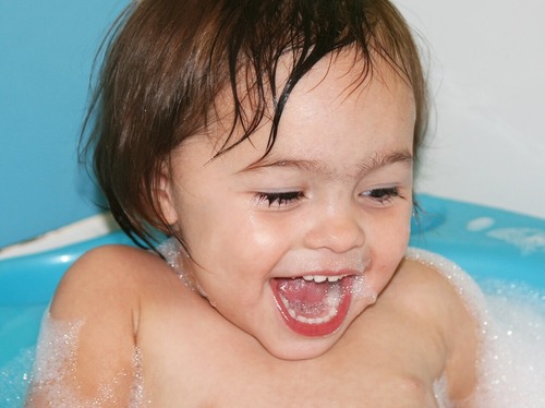 toddler in bath