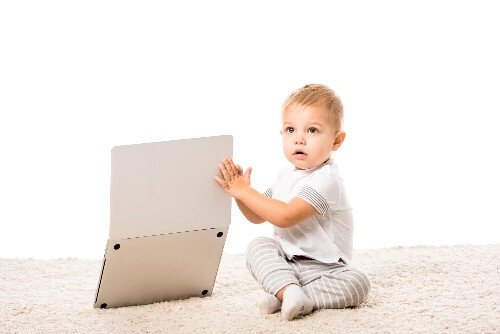 Toddler playing with computer