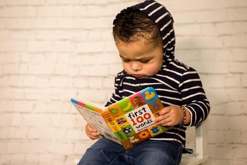 Child reading a picture book.